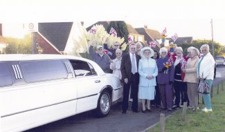 The neighbours crowd round to watch Audrey well on this special day