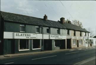 The shop to the left of the alleyway was the second library