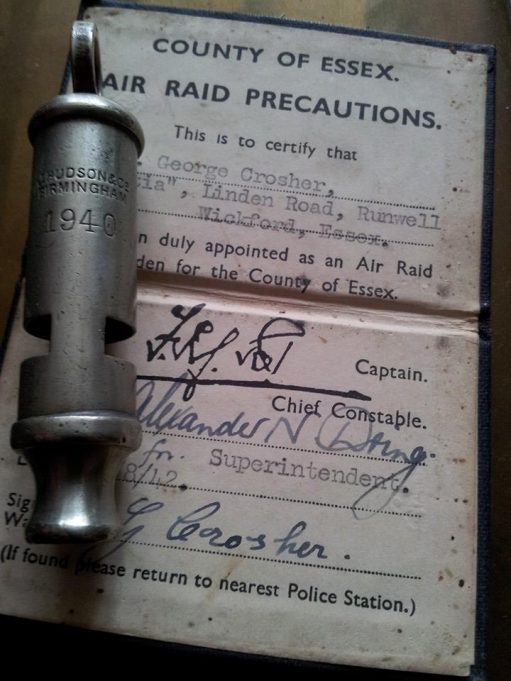 Photograph shows the Identification Card and 1940 dated ARP Warden's whistle that formally belonged to ARP Warden Mr. George Crosher. George lived in a bungalow, 